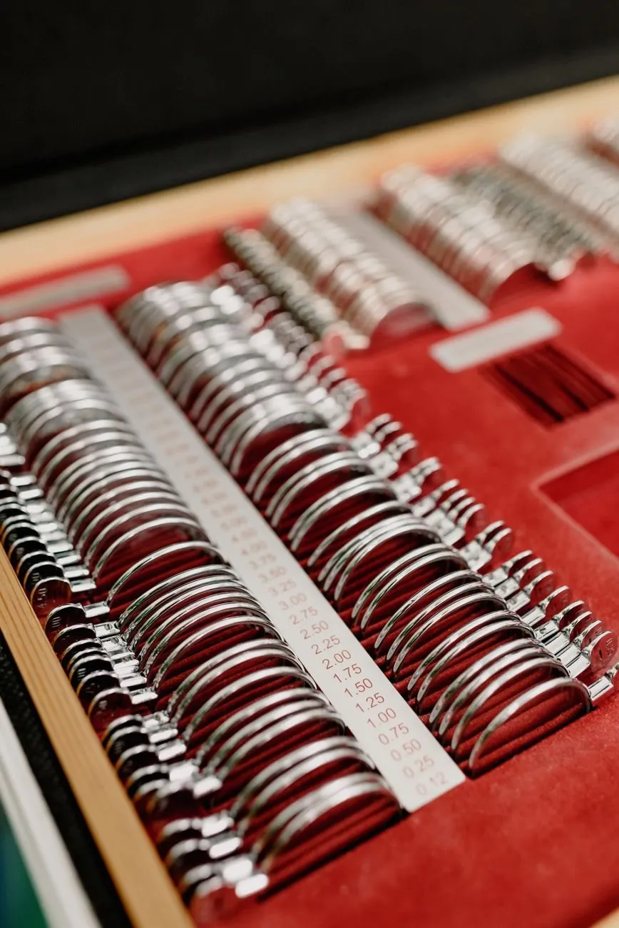 A case of trial lenses in red velvet, marked with their powers